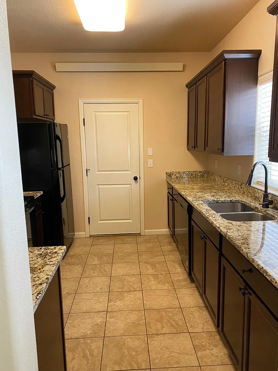 Kitchen that leads to the garage. - 10441 Mesa View Ct