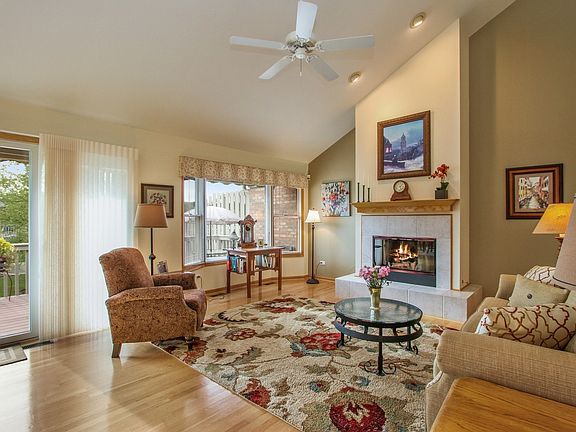 Wonderful open flow with gas fireplace and access out to your deck and views of the pond