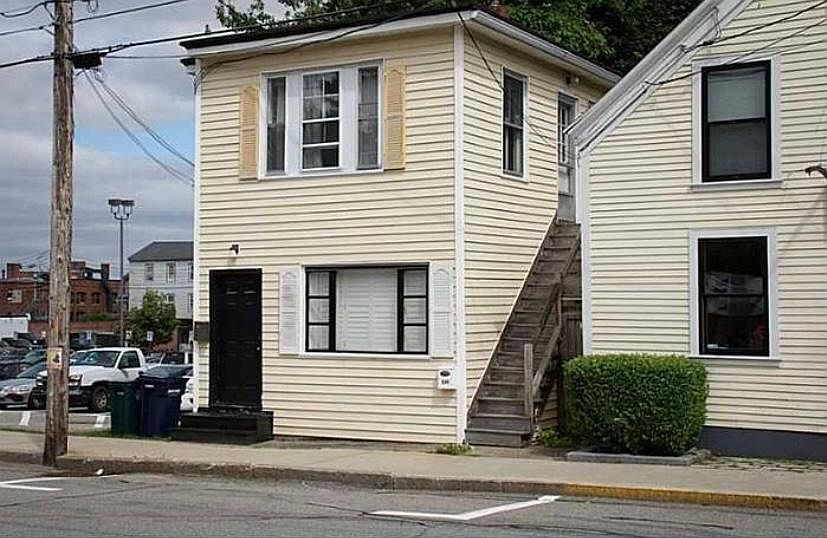 Building with the black door, two apartments - bottom & top floor.