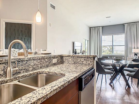 Revel in kitchens adorned with designer granite countertops and gleaming stainless-steel appliances.