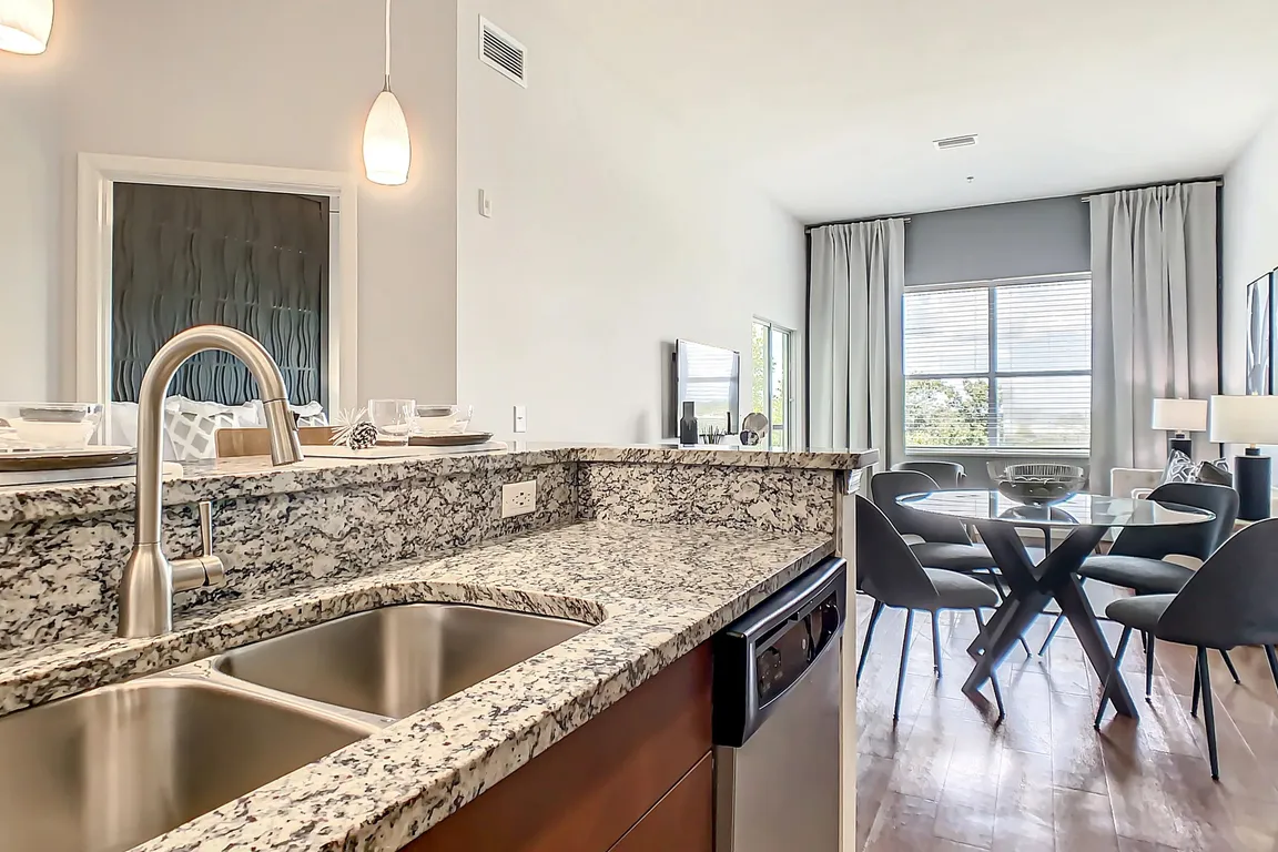 Revel in kitchens adorned with designer granite countertops and gleaming stainless-steel appliances.