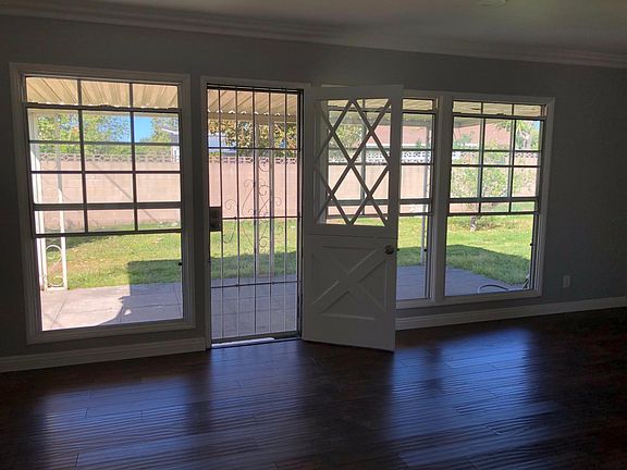Bright and Airy living room with the view of the backyard.