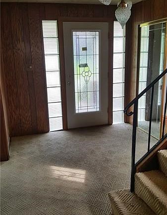 Large entryway with coat closet
