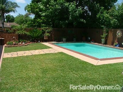 Backyard : View from right side of backyard. Pool was resurfaced in 2009.