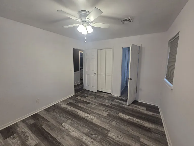 Bedroom 2 attached to half bathroom