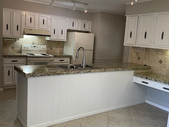 Open eat-in kitchen with desk area