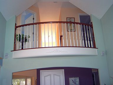 Balcony overlooking Family Room with Vaulted Ceiling French Doors to patio 