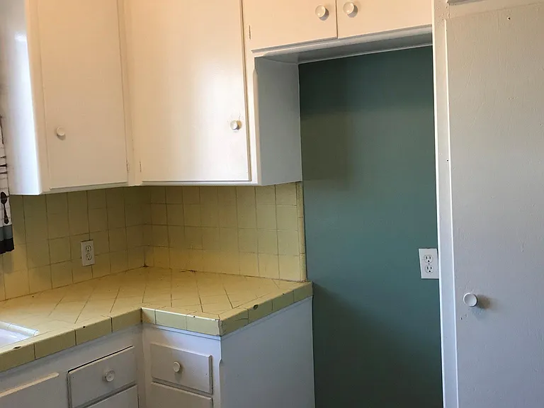 Old paint Kitchen counter & space for fridge