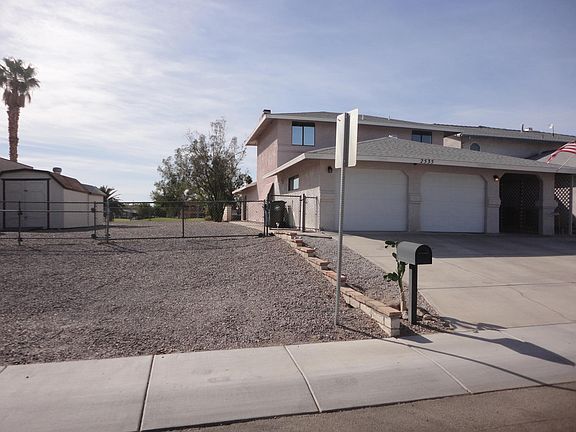 Front of home with large side lot.