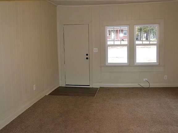 View of front door in the living room.