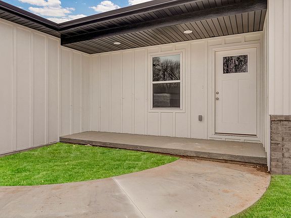 Lawn is digitally added due to being new construction.