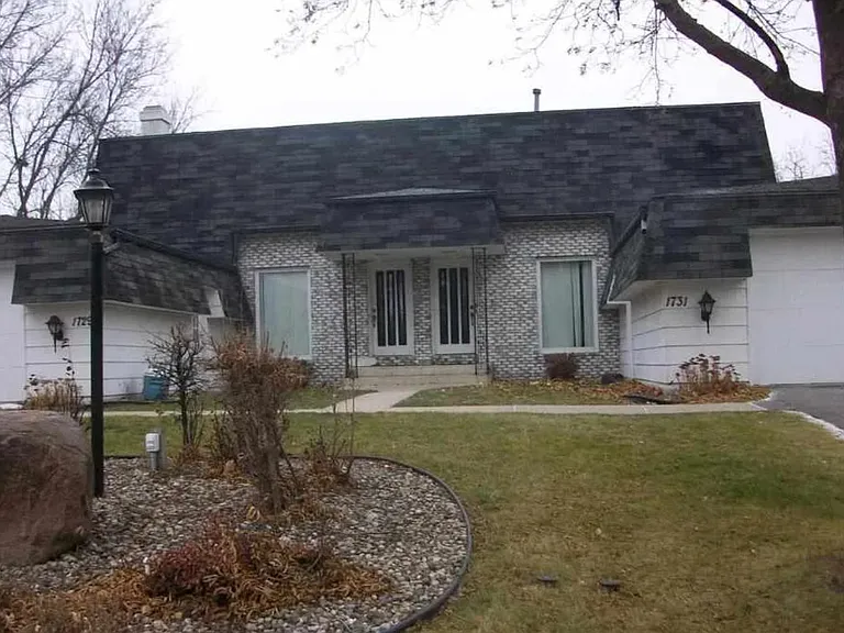 townhouse is on the right with large double car garage