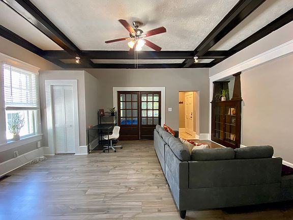 Living Room. Decorative wood beam high ceilings. Storage Closet.