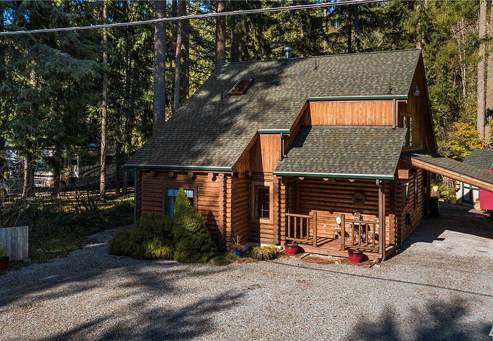 One-Owner, True Log Home with 67'+/- of Nisqually River frontage.