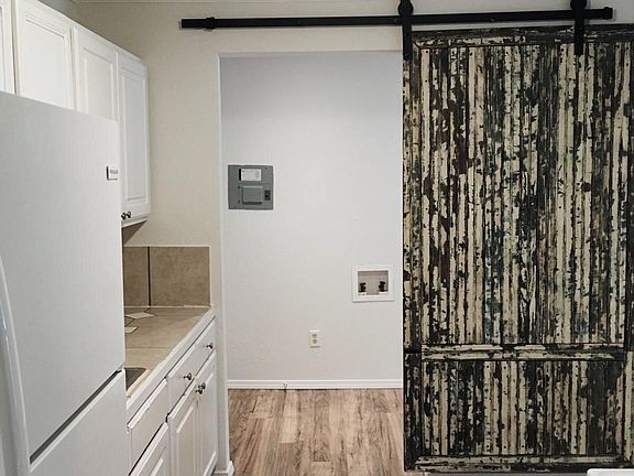 Utility with Reclaimed Wood Barn Door