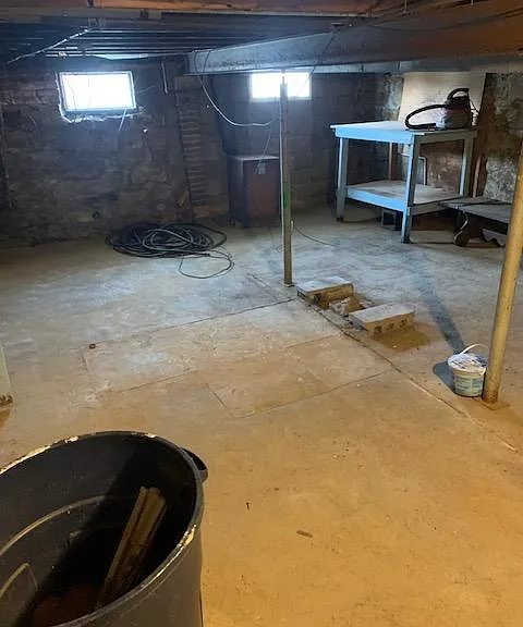 Basement with storage room and work area