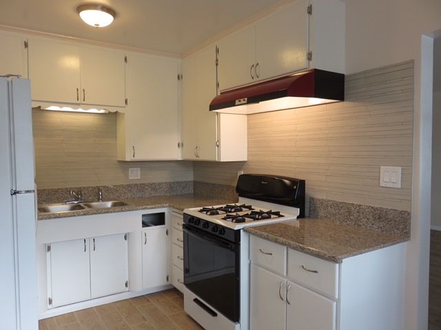 Kitchen with granite counter, Stove/oven, Refriegerator, large double sink with garbage disposal