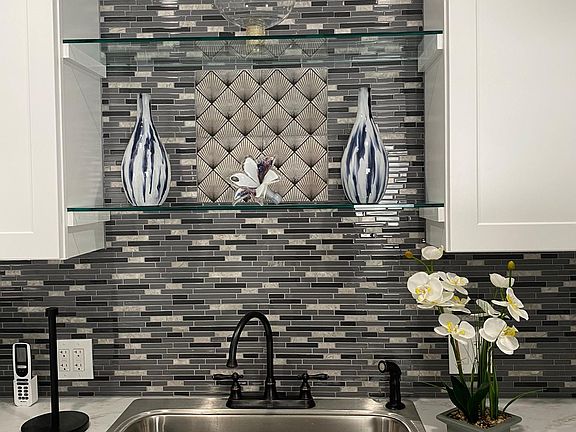 View of New Glass Shelving about the sink