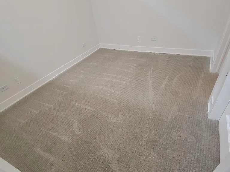 bedroom un-staged walk in closet