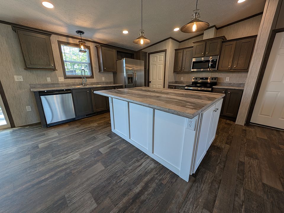 Large Open kitchen with huge island with overhang for bar stools