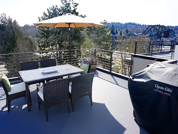 Rooftop deck with outdoor setting and BBQ