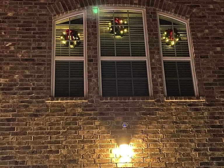 View of the front of the house of the master bedroom windows