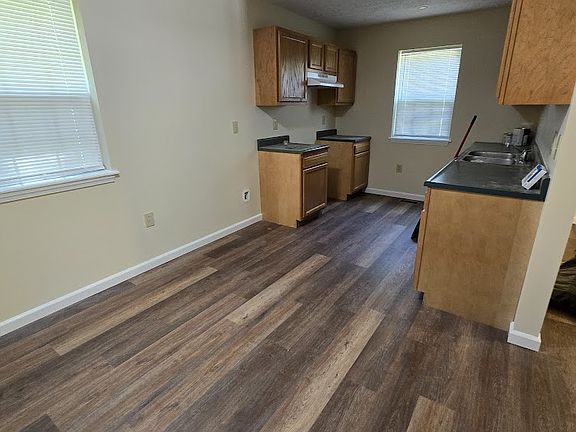 We now have new white appliances in the kitchen. View of Kitchen from hallway
