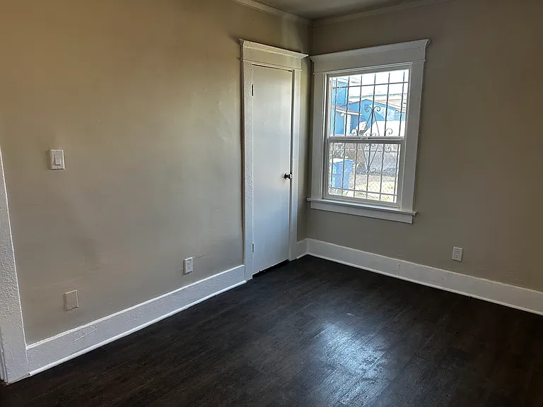 Good sized bedroom with ceiling fan and closet.