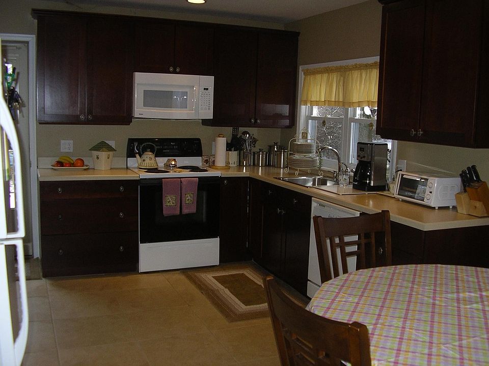 Cherry Wood Cabinets with Ceramic Floors