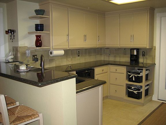 Renovated kitchen with custom tile and granite.