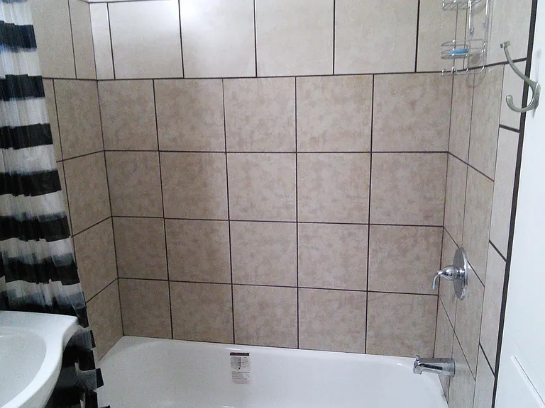 Newer tub and tiled surround