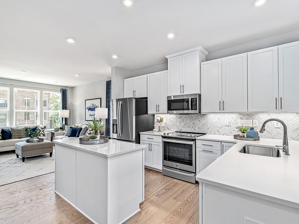 Open House Sat Sun 12-3pm featuring modern garage townhomes in Reservoir Hill