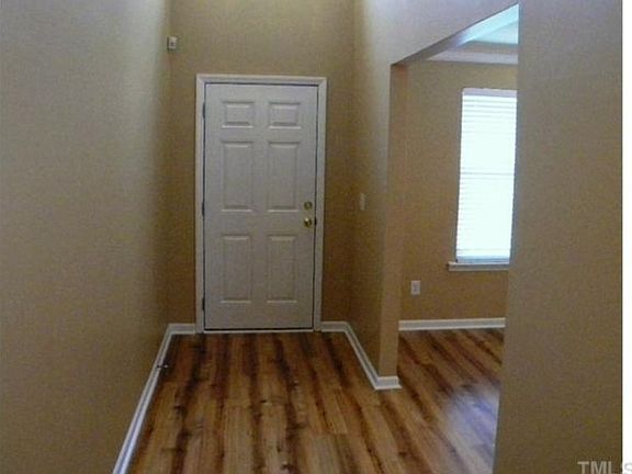 Welcoming entry foyer with rich laminate on entire first floor.