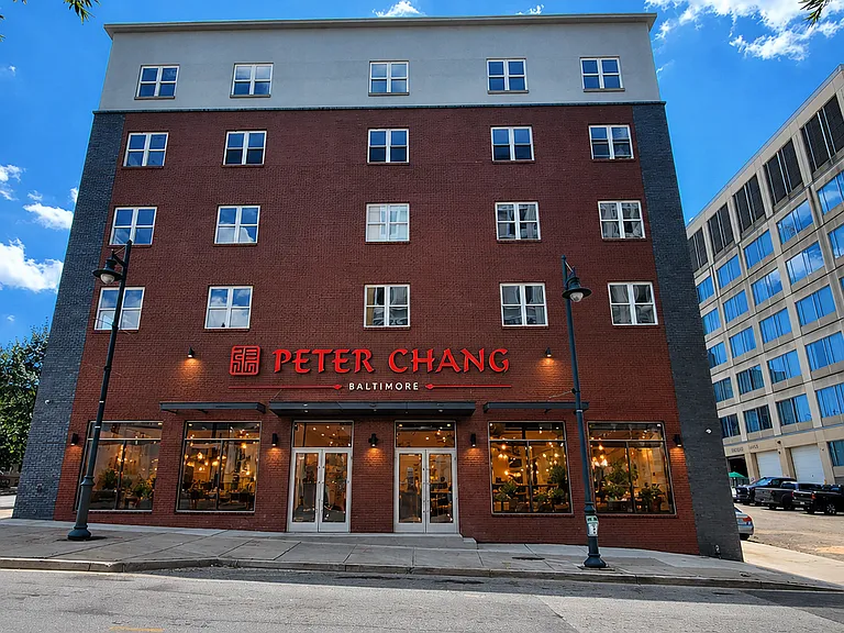 Apartment building featuring the acclaimed Peter Chang restaurant on the first floor_perfect for a quick bite.