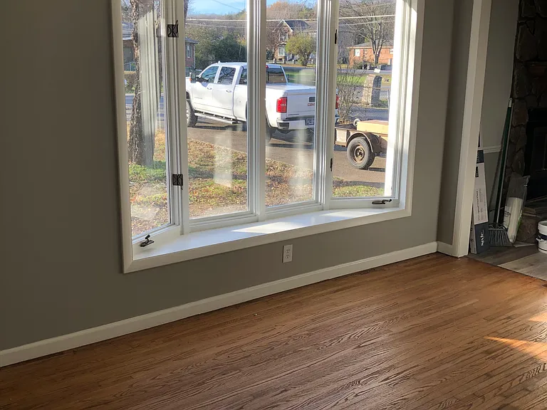 Sun kissed living room through bay windows