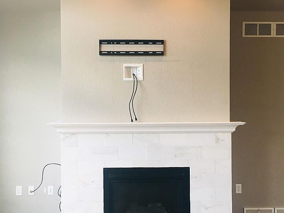 Fireplace with tv mount above