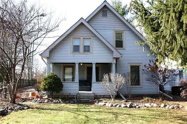 Front of home with large porch.