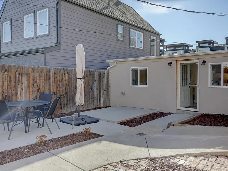 Outdoor patio with fenced yard.