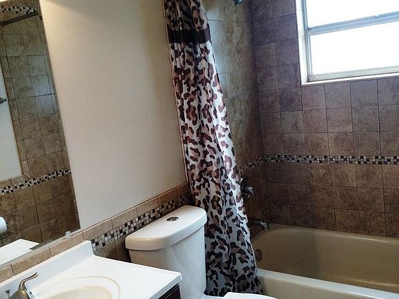 UPDATED FIXTURES, TILE, AND VANITY