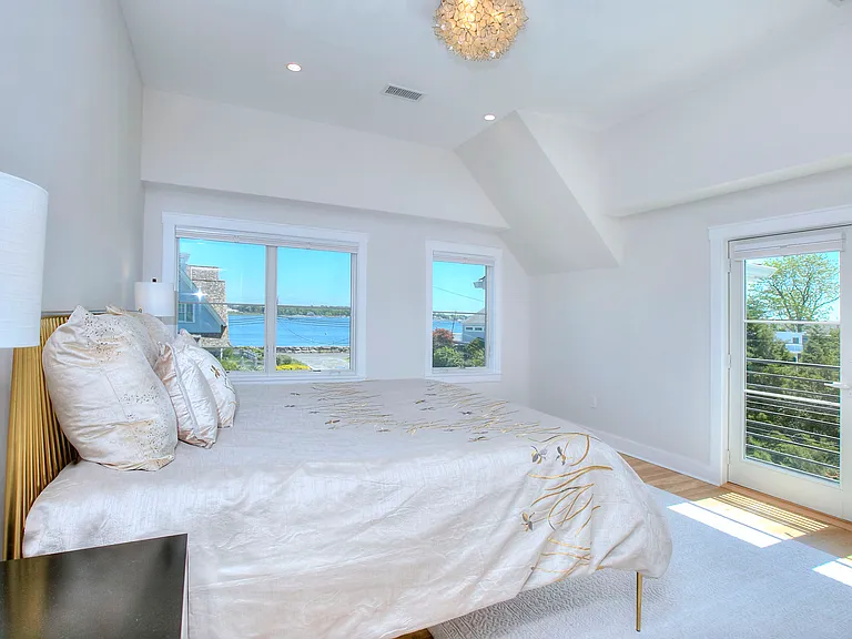 Primary bedroom with direct water views