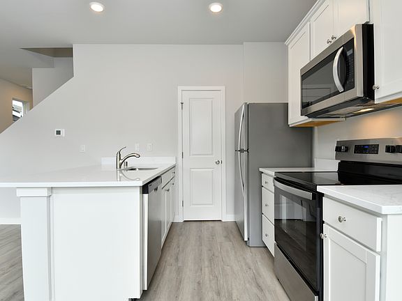 Each kitchen has stainless steel appliances included.
