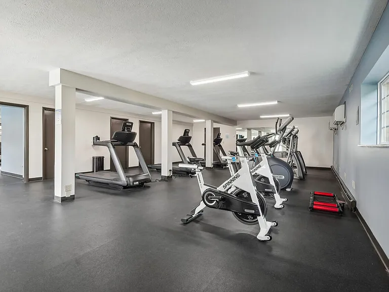 Stay active in the fully equipped fitness center at University Oaks Apartments near Kent State University.