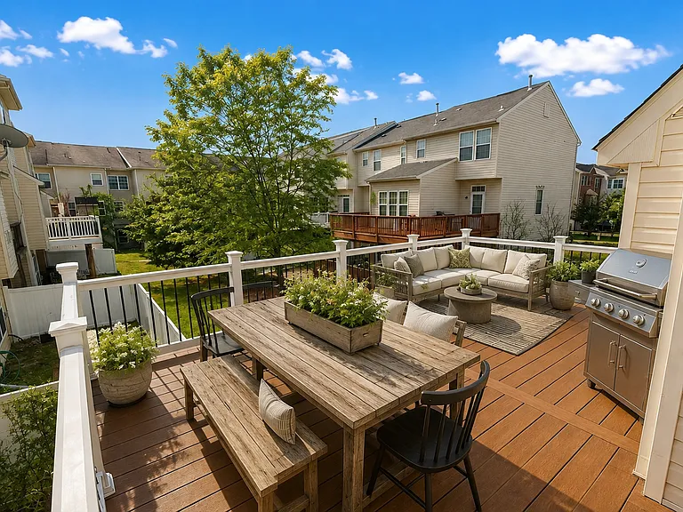 This outdoor deck is so inviting you'll spend hours back here entertaining, relaxing...unhurried. (Photos are virtually staged)