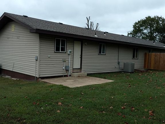 Rear door with patio & privacy fence