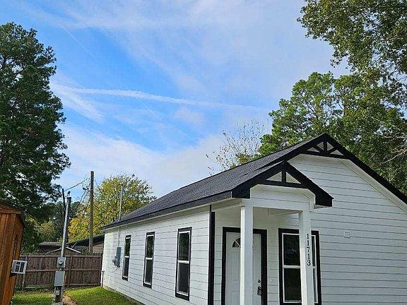 Left side shows stylish entry porch with LED lighting