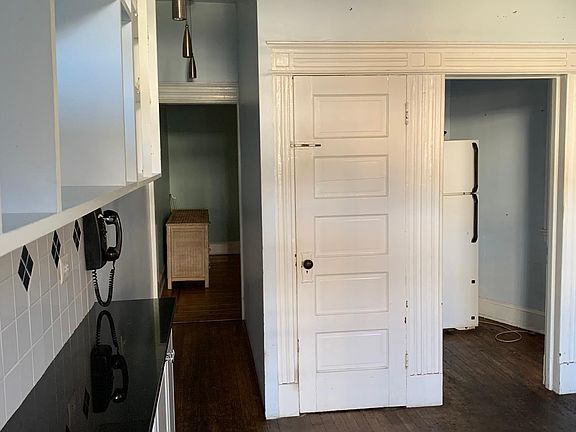 hallway and kitchen as well as door to basement (unfinished but has new washer and dryer)