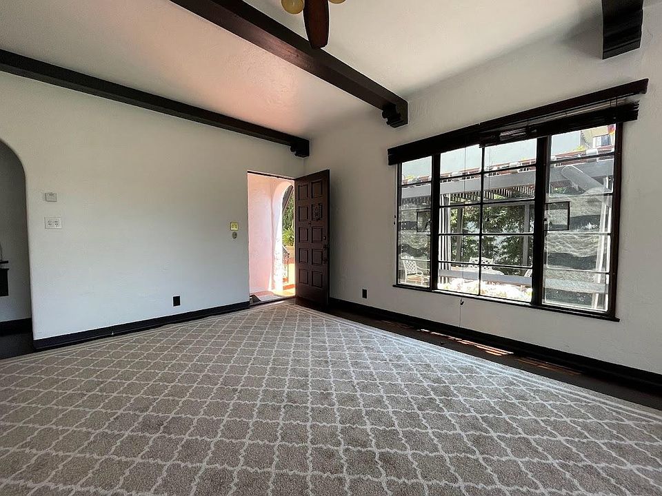 spacious, light filled living room - note private patio from living room window