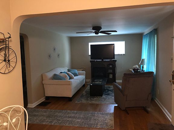 Family Room with Gleaming Hardwood Floors and New Windows
