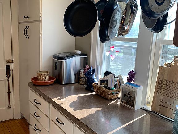 concrete countertops, pantry closet & hanging pot rack