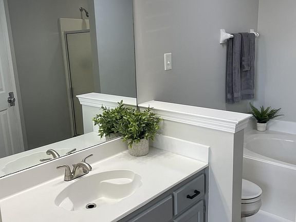 Master Bathroom with jetted tub, separate shower and large walk-in closet